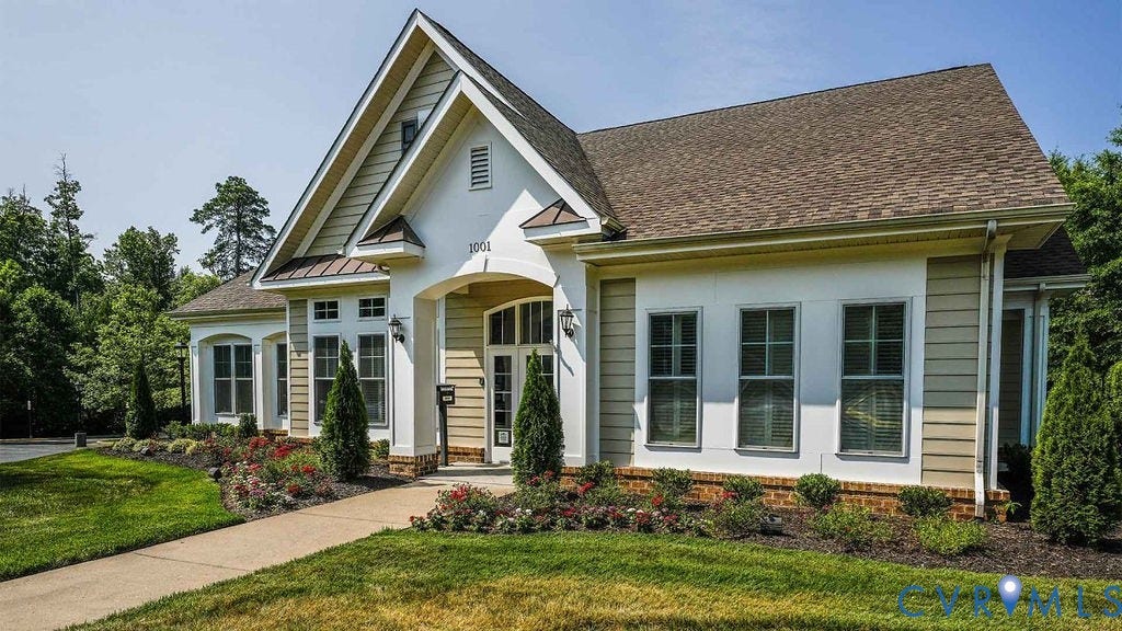 14007 Shawhan Court, Charter Colony, Midlothian, VA 23114 Gable roofline with dormer accent, arched portico, mixed siding and stucco exterior, well-maintained landscaping, and a concrete pathway