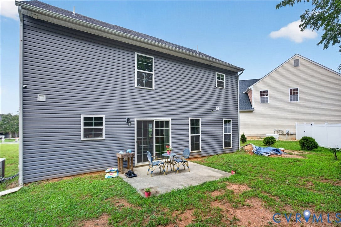 311 Cardinal Road, Countryside, Louisa, VA 23093 Rear exterior featuring gray horizontal siding and a concrete patio