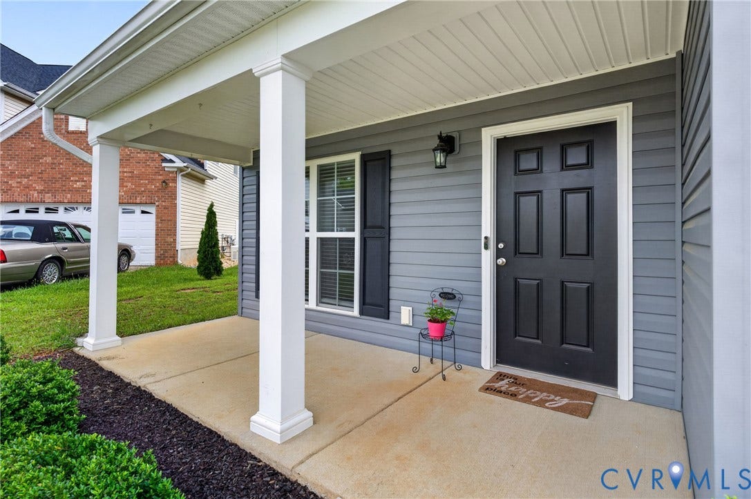 311 Cardinal Road, Countryside, Louisa, VA 23093 Covered front porch featuring white columns and a concrete floor