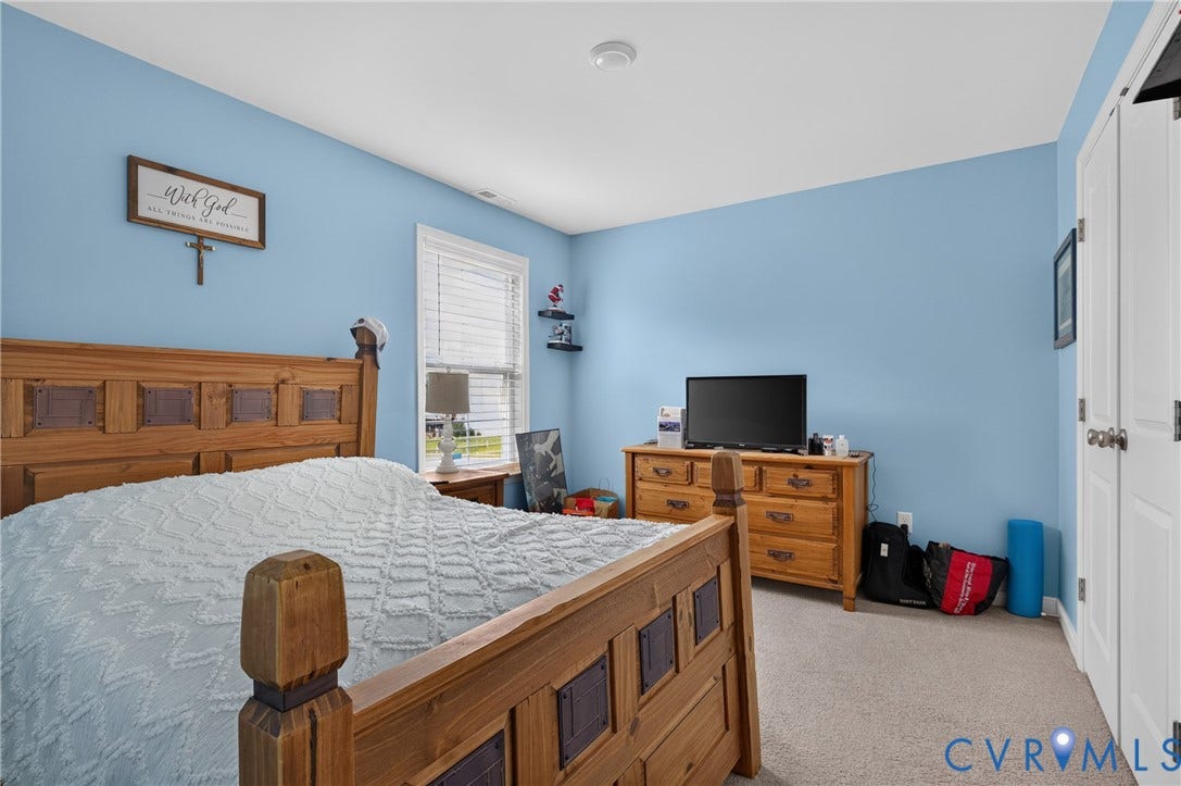 311 Cardinal Road, Countryside, Louisa, VA 23093 Spacious room with a light blue wall finish and neutral carpeting