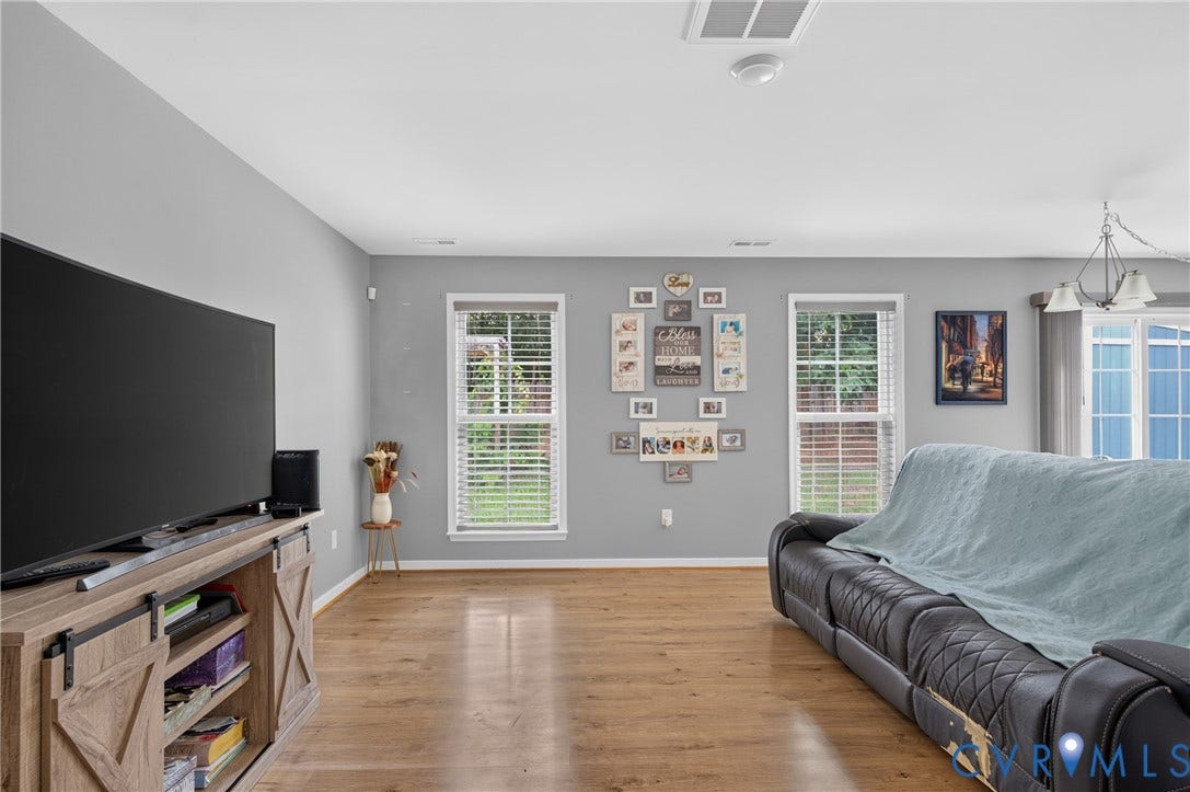 311 Cardinal Road, Countryside, Louisa, VA 23093 Open-concept living area featuring wood-finish flooring, light gray wall paint, and white trim