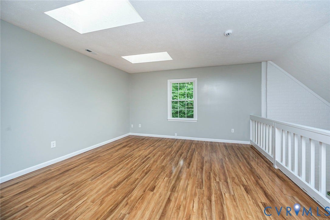 14001 Branched Antler Drive, Antler Ridge, Midlothian, VA 23112 Wood-finish flooring, white railing, skylights, window with exterior foliage