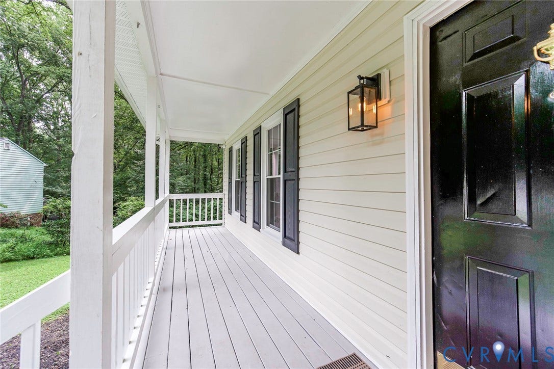 14001 Branched Antler Drive, Antler Ridge, Midlothian, VA 23112 Expansive covered porch with painted decking, white railings, and vinyl siding