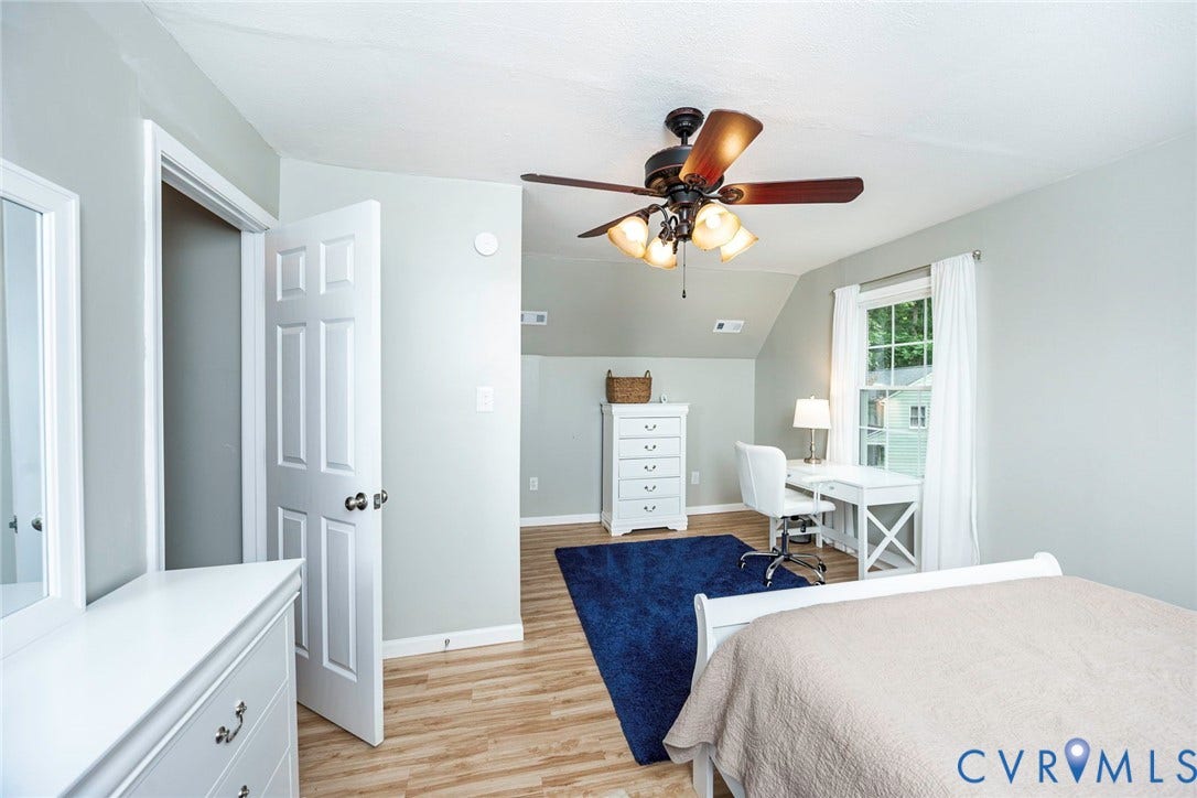 14001 Branched Antler Drive, Antler Ridge, Midlothian, VA 23112 Wood-finish flooring, ceiling fan with integrated lighting, window with ample natural light, and a white paneled door