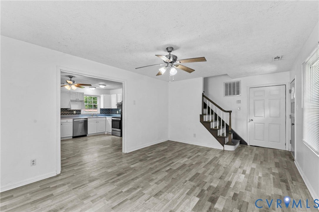 12870 King William Road, King William, VA 23086 Wood-finish flooring throughout, bright white walls, and a ceiling fan with light fixture