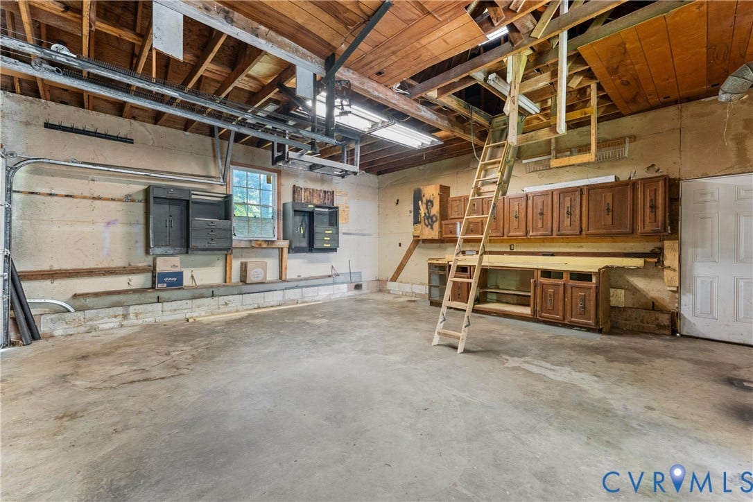 12870 King William Road, King William, VA 23086 Concrete flooring, exposed wood beam ceiling, built-in cabinetry, and a window for natural light