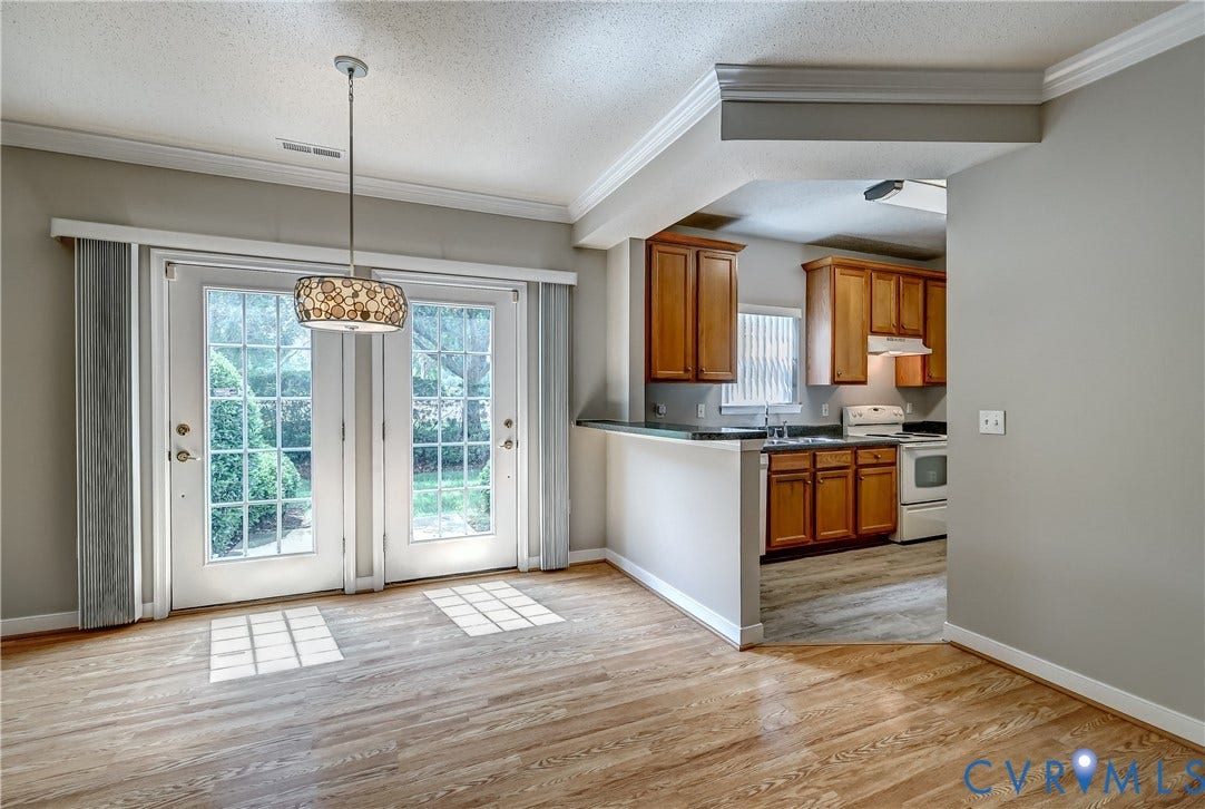 4602 Twin Hickory Lake Drive, Twin Hickory, Glen Allen, VA 23059 Former model home with bright patio doors in front of the dining area.