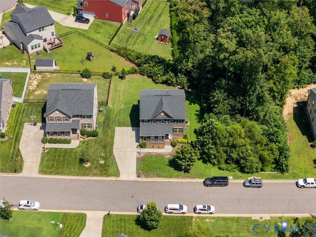 10419 Centralia Station Road, Chester, VA 23831 Two-story residence with a gabled roof and a paved driveway leading to a two-car garage