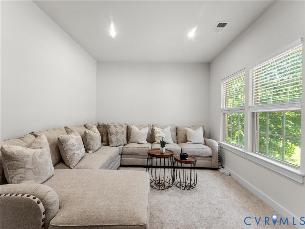 10419 Centralia Station Road, Chester, VA 23831 Carpeted room featuring multiple windows with blinds, recessed lighting, and white baseboards