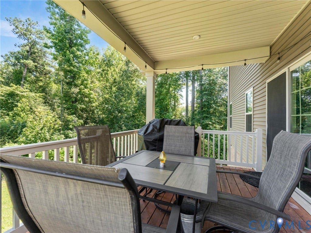 10419 Centralia Station Road, Chester, VA 23831 Covered deck featuring wood-finish flooring, white railing, and exterior wall siding