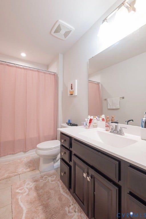 10419 Centralia Station Road, Chester, VA 23831 Bathroom vanity featuring a built-in sink, dark wood-finish cabinetry, and a large wall-mounted mirror