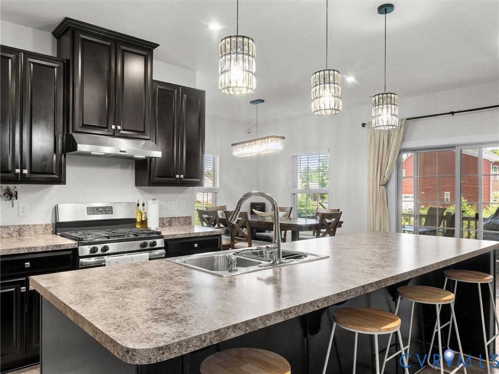 10419 Centralia Station Road, Chester, VA 23831 Expansive kitchen island featuring an undermount sink and bar seating