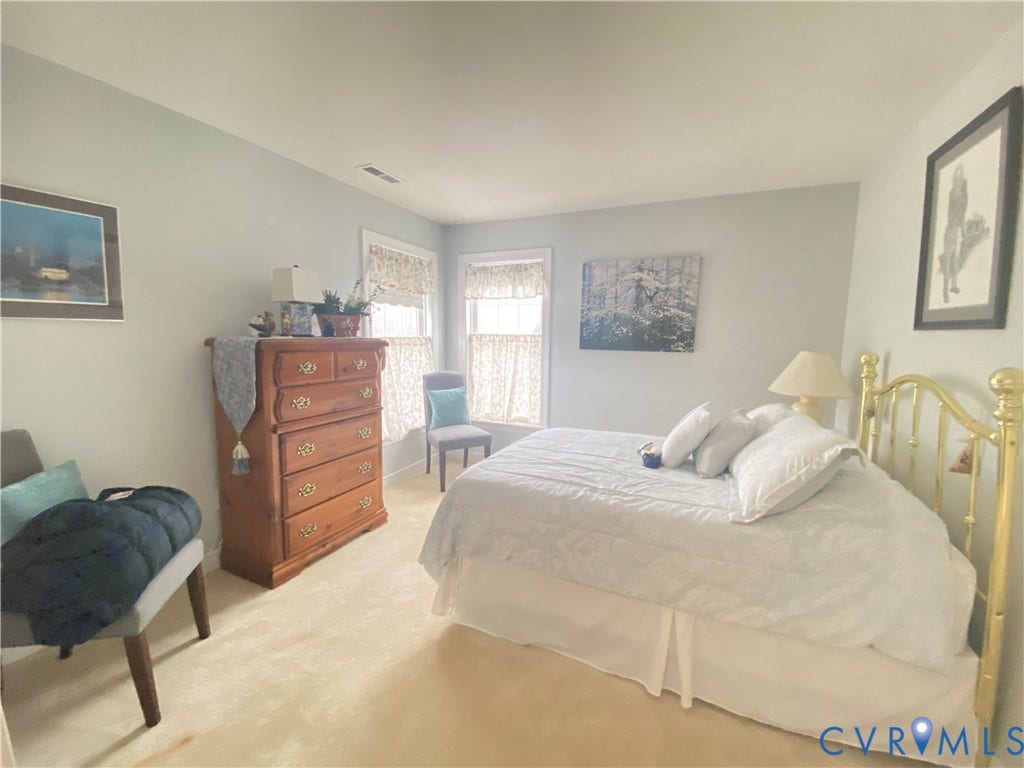 3267 Bayberry Lane, Goochland, VA 23063 Carpeted room featuring multiple windows with valances and light-colored walls
