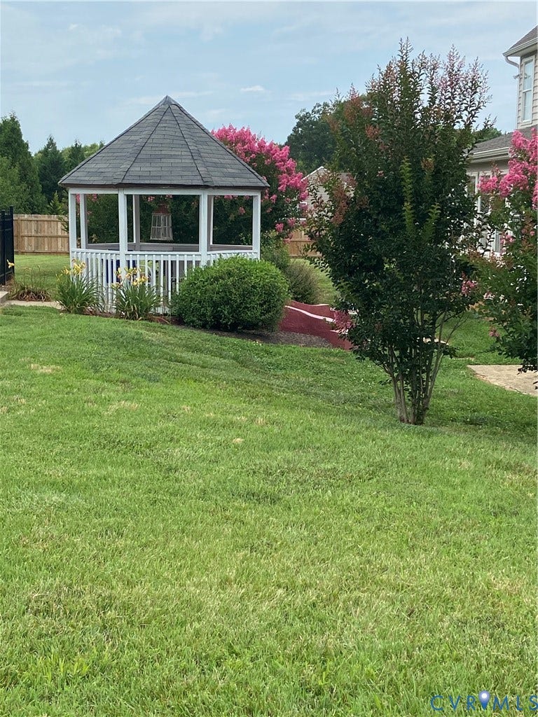 3267 Bayberry Lane, Goochland, VA 23063 White gazebo with a dark shingle roof and surrounding landscaping