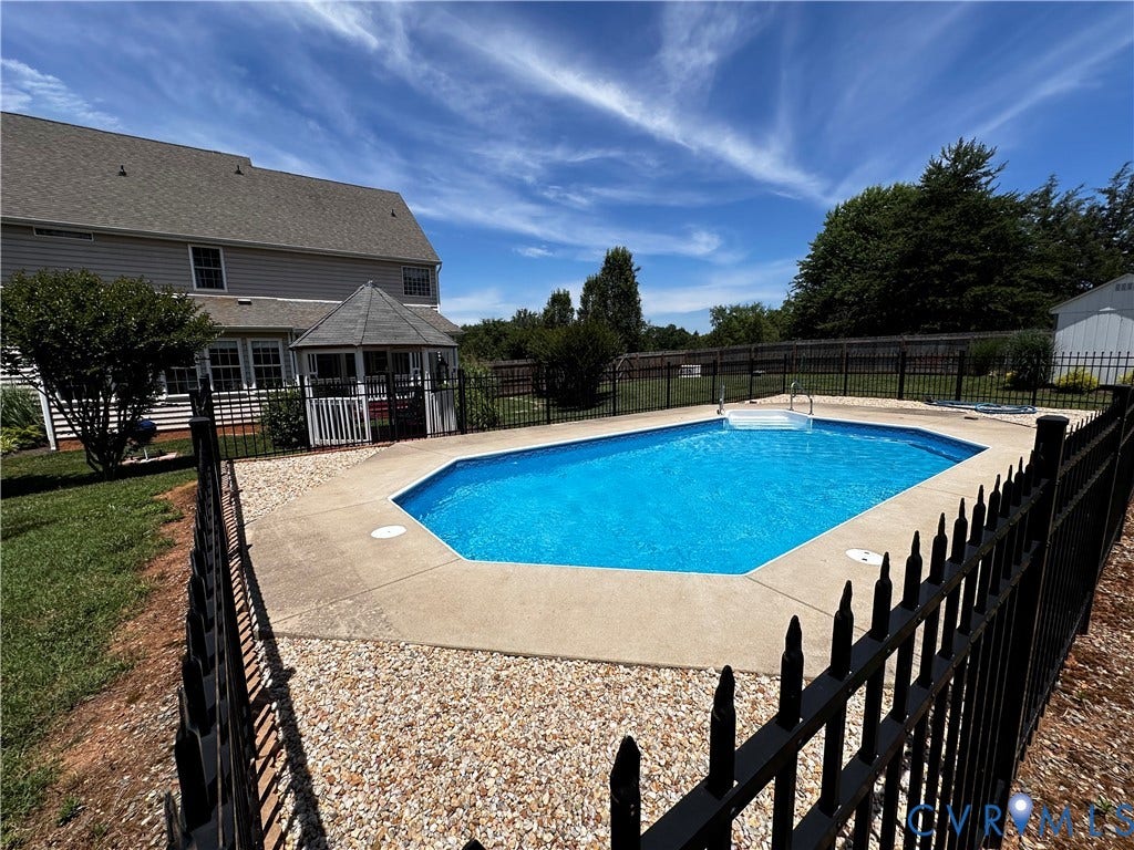 3267 Bayberry Lane, Goochland, VA 23063 Fenced backyard featuring an in-ground swimming pool with concrete surround and a nearby gazebo structure