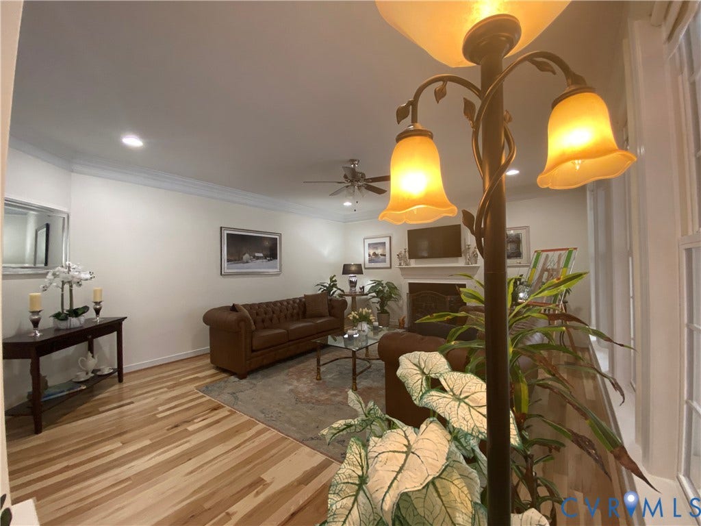 3267 Bayberry Lane, Goochland, VA 23063 Living area featuring light wood-finish flooring, recessed lighting, crown molding, and a built-in fireplace with a mantel