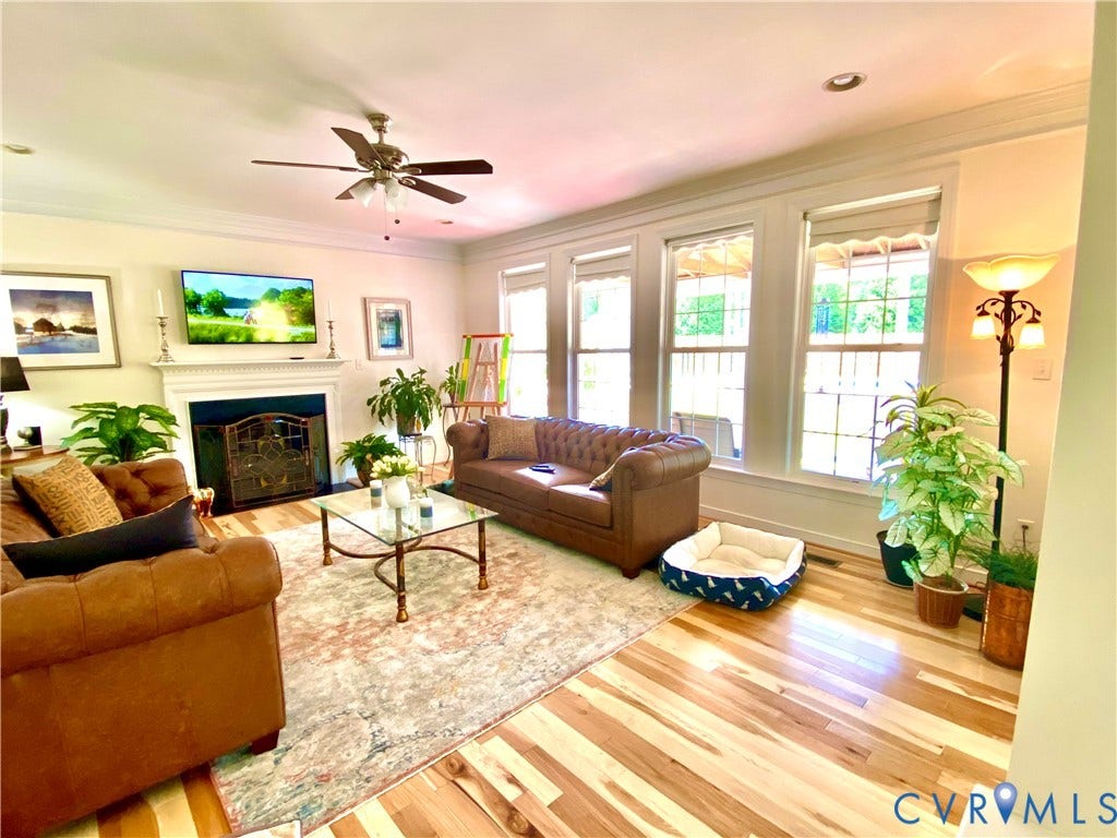 3267 Bayberry Lane, Goochland, VA 23063 Living area featuring wood-finish flooring, a white mantelpiece, and a ceiling fan