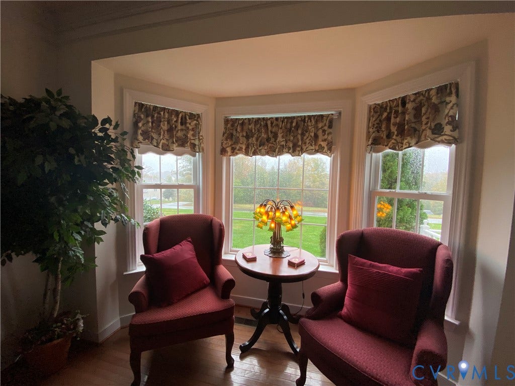 3267 Bayberry Lane, Goochland, VA 23063 Bay window featuring three large windows, white trim, and patterned valances