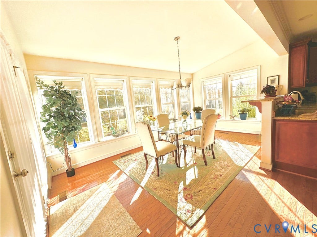 3267 Bayberry Lane, Goochland, VA 23063 Dining area with wood-finish flooring and extensive windows
