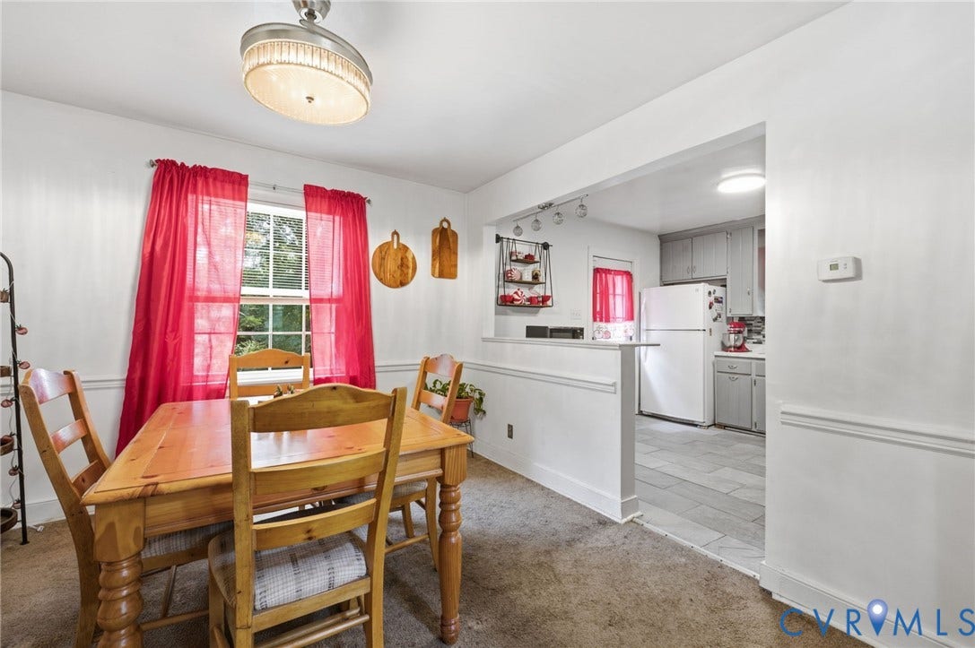 4021 Beulah Road, Chesterfield, VA 23237 Dining area featuring a window, overhead light fixture, and a partial wall separating it from the kitchen