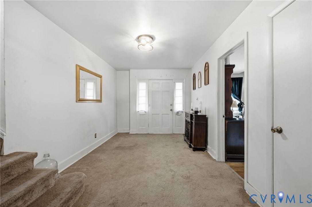 4021 Beulah Road, Chesterfield, VA 23237 Entryway featuring a white paneled door with frosted glass sidelights and transom window, overhead flush mount lighting, and neutral carpet flooring