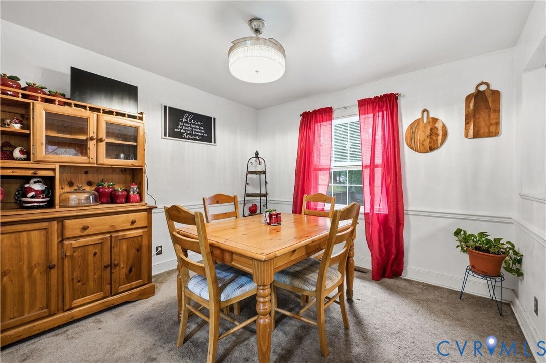 4021 Beulah Road, Chesterfield, VA 23237 Dining area featuring a central window, white walls with chair rail molding, and a ceiling-mounted light fixture