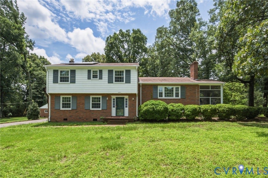 4021 Beulah Road, Chesterfield, VA 23237 Brick and siding two-story residence featuring a front lawn and mature trees