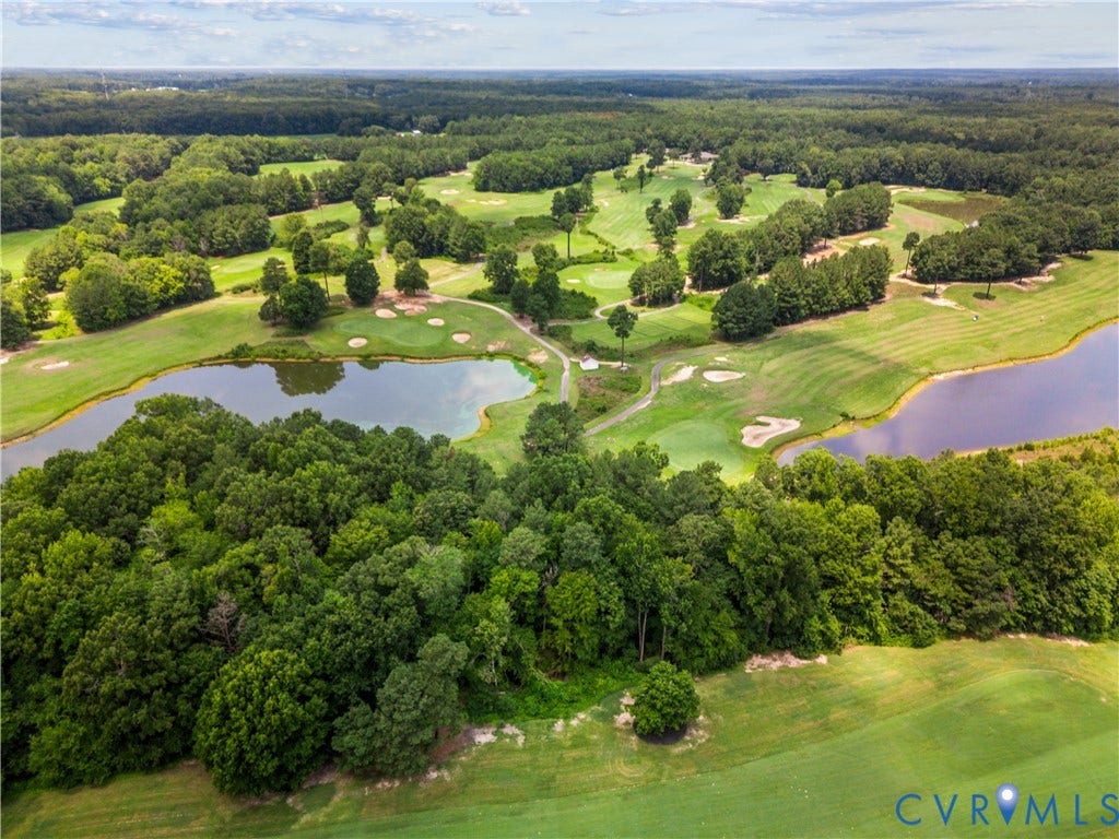 Expansive golf course landscape featuring multiple greens and fairways