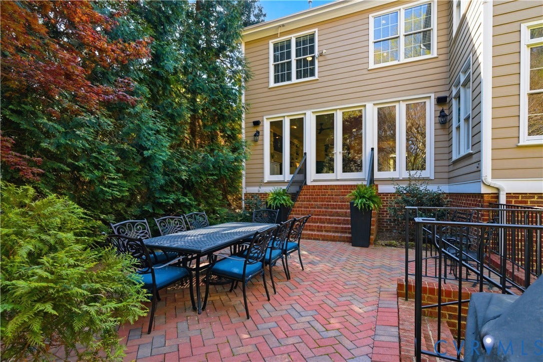 Brick paver patio with a herringbone pattern