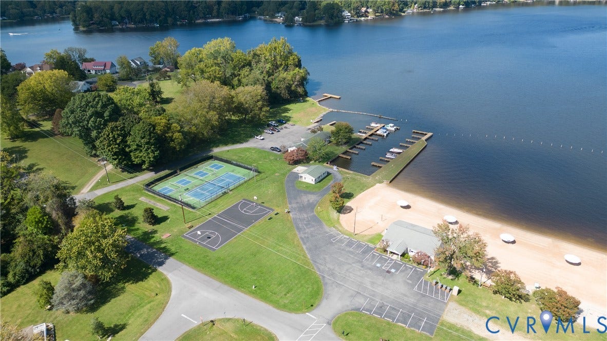 309 Ellis Drive, Louisa, VA 23093 Waterfront property featuring a sandy beach, boat slips, and a marina