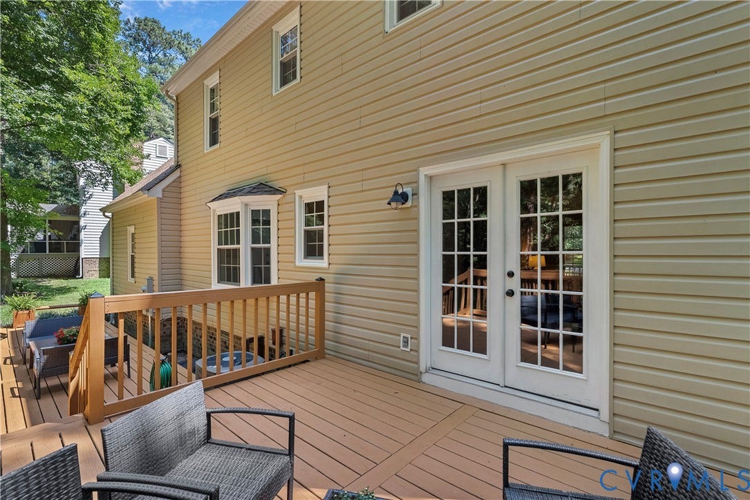 13908 Sterlings Bridge Road, Midlothian, VA 23112 Expansive deck featuring wood decking, wood railings, and direct access through double French doors with grid-patterned glass