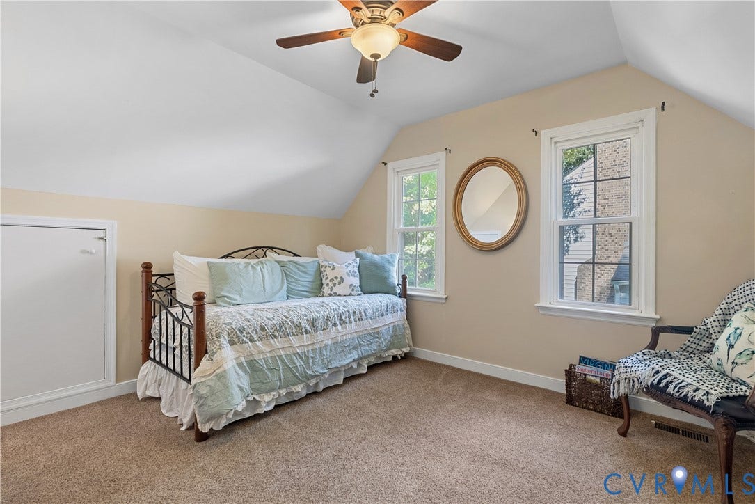 13908 Sterlings Bridge Road, Midlothian, VA 23112 Vaulted ceiling with a ceiling fan, two double-hung windows, and wall-to-wall carpeting