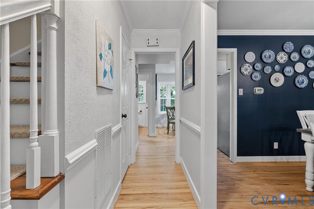 13908 Sterlings Bridge Road, Midlothian, VA 23112 Hardwood-style flooring throughout, white painted trim, white paneling, and a staircase with white spindles