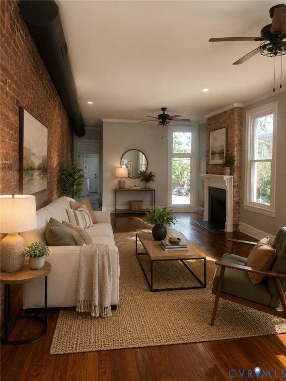 1100 W Marshall Street, Richmond, VA 23220 Living area featuring exposed brick walls, rich wood-finish flooring, recessed lighting, and a fireplace with a white mantel