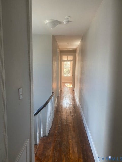 1100 W Marshall Street, Richmond, VA 23220 Long hallway with wood flooring and light neutral wall paint