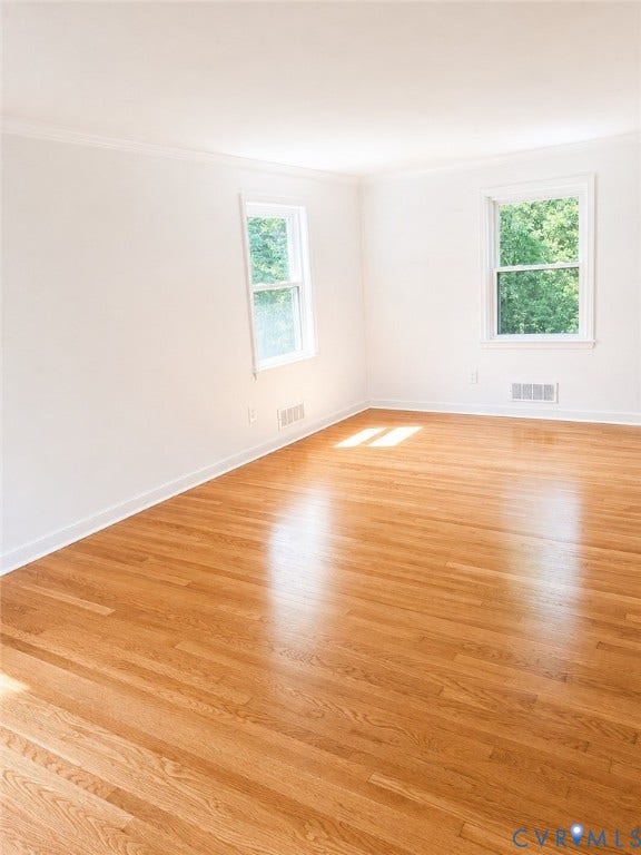 10250 Epsilon Road, Southwest, Richmond, VA 23235 Hardwood flooring extending throughout, complemented by white baseboards and crown molding
