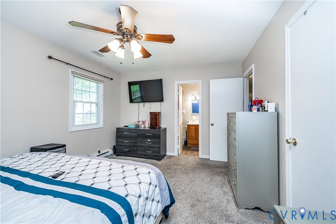 19105 Braebrook Drive, Chesterfield, VA 23834 Carpeted bedroom featuring a double-hung window, ceiling fan with integrated lighting, and neutral wall tones