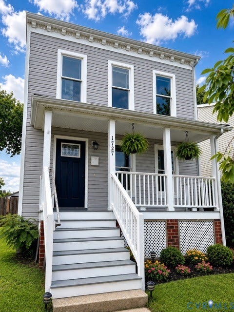 1727 W Leigh Street, Newtowne West, Richmond, VA 23220 Two-story residential exterior featuring light gray horizontal siding and white trim