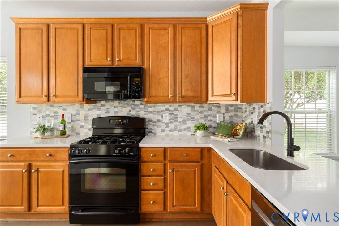 5806 Park Creste Drive, Glen Allen, VA 23059 Kitchen featuring light wood cabinetry, white countertops, tile backsplash, stainless steel sink, and black appliances
