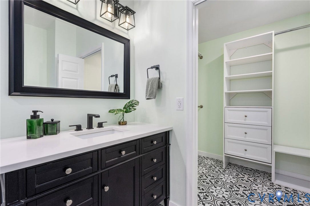 5806 Park Creste Drive, Glen Allen, VA 23059 Bathroom vanity featuring a white countertop, undermount sink, and matte black faucet