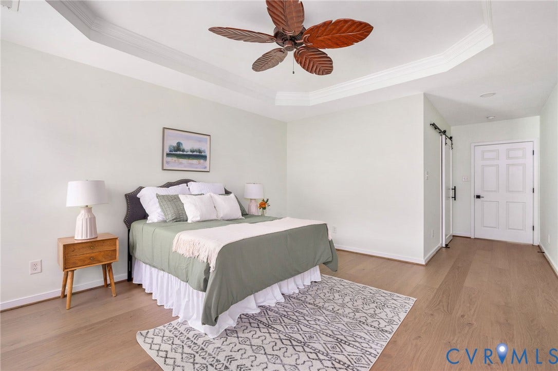 5806 Park Creste Drive, Glen Allen, VA 23059 Spacious room featuring tray ceiling, wood-finish flooring, ceiling fan, and light green wall tones