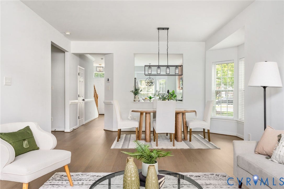 5806 Park Creste Drive, Glen Allen, VA 23059 Open-concept living space featuring wood-finish flooring, a dining area with a linear chandelier, and a bay window
