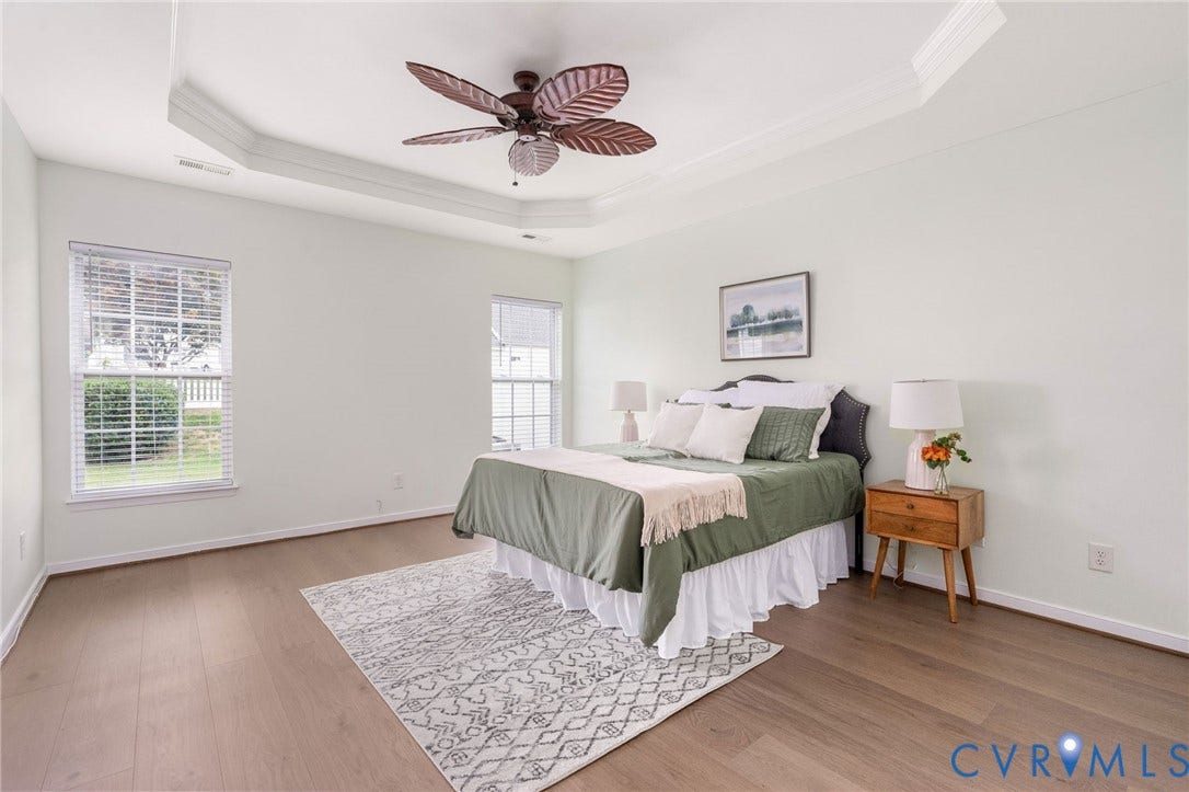 5806 Park Creste Drive, Glen Allen, VA 23059 Spacious room featuring wood-finish flooring, a tray ceiling, and a ceiling fan with leaf-shaped blades
