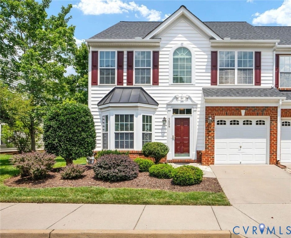 5806 Park Creste Drive, Glen Allen, VA 23059 Two-story traditional exterior featuring white siding and red brick accents