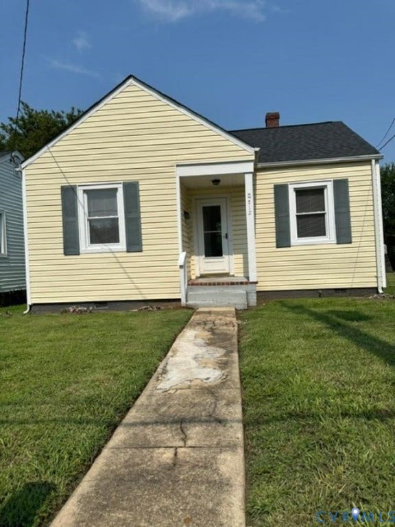 712 S Meadow Street, Richmond, VA 23220 Yellow vinyl-sided home featuring a covered front entry with white railings