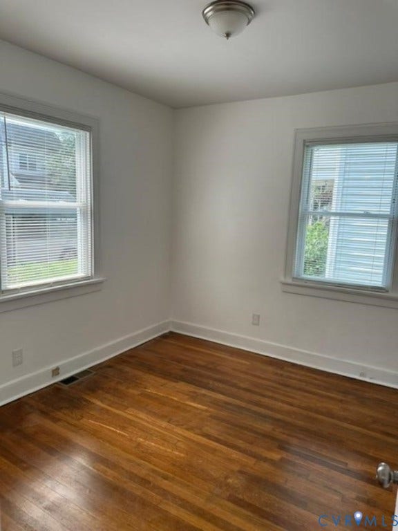 712 S Meadow Street, Richmond, VA 23220 Hardwood flooring throughout featuring white baseboards, trim, and wall finishes