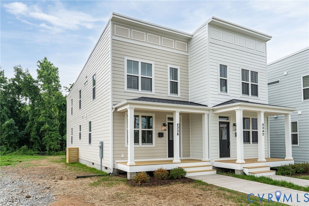 4338 North Avenue, Ginter Park, Richmond, VA 23222 Contemporary duplex featuring light-colored siding, a covered front porch with white columns, and multiple windows