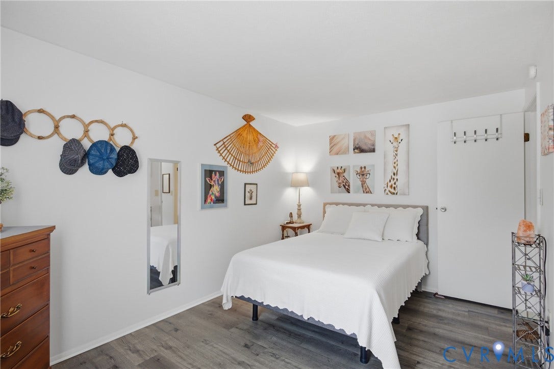 2007 Mountain Pine Boulevard, Three Pines, Richmond, VA 23235 Wood-finish flooring with white walls and a white door with a silver handle