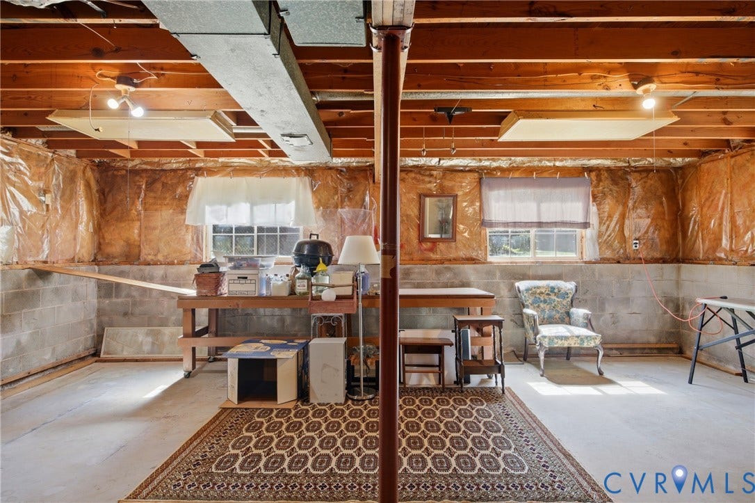 2007 Mountain Pine Boulevard, Three Pines, Richmond, VA 23235 Unfinished lower level featuring exposed wooden ceiling joists, concrete block walls, and multiple windows