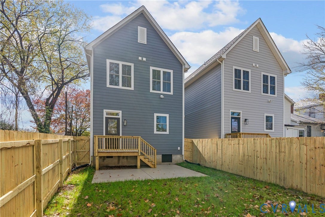 1103 Carlisle Avenue, Montrose Heights, Richmond, VA 23231 Fenced backyard featuring a wooden deck with stairs, a concrete patio, and a grass lawn